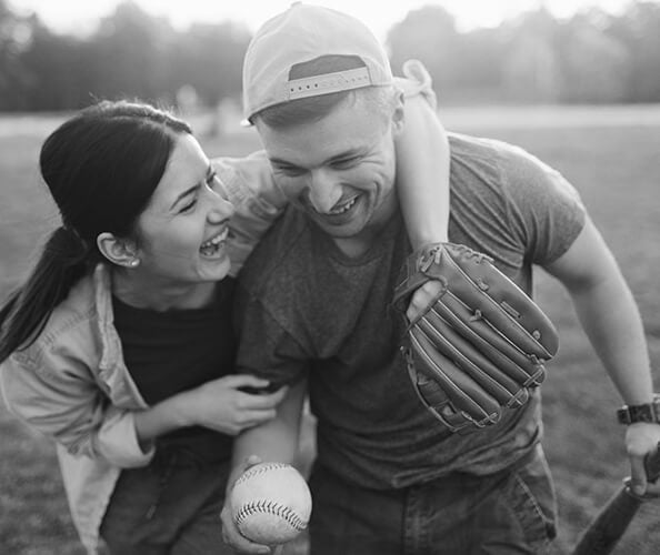 couple playing baseball